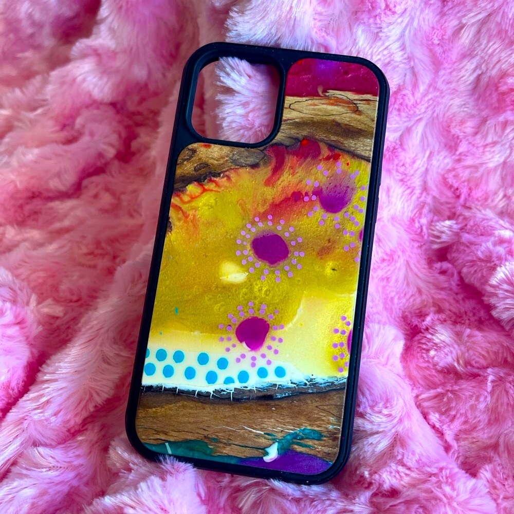 2 iPhone 12 Pro cases by Carved, 1 by Zeeb Labs.